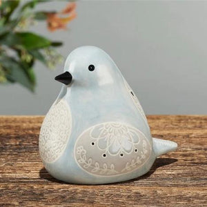 side view of Bird Song Collection Dove Decorative Figurine on tabletop