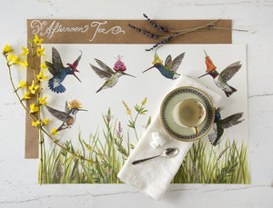 Meadow Buzz Hummingbirds Paper Placemats displayed on a dinner tabletop